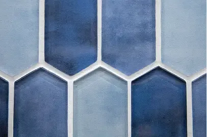 Glazed blue tile installed in a running bond pattern