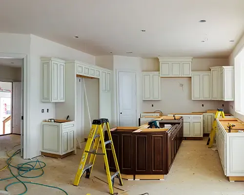 Kitchen remodel in progress with new cabinets and a center island